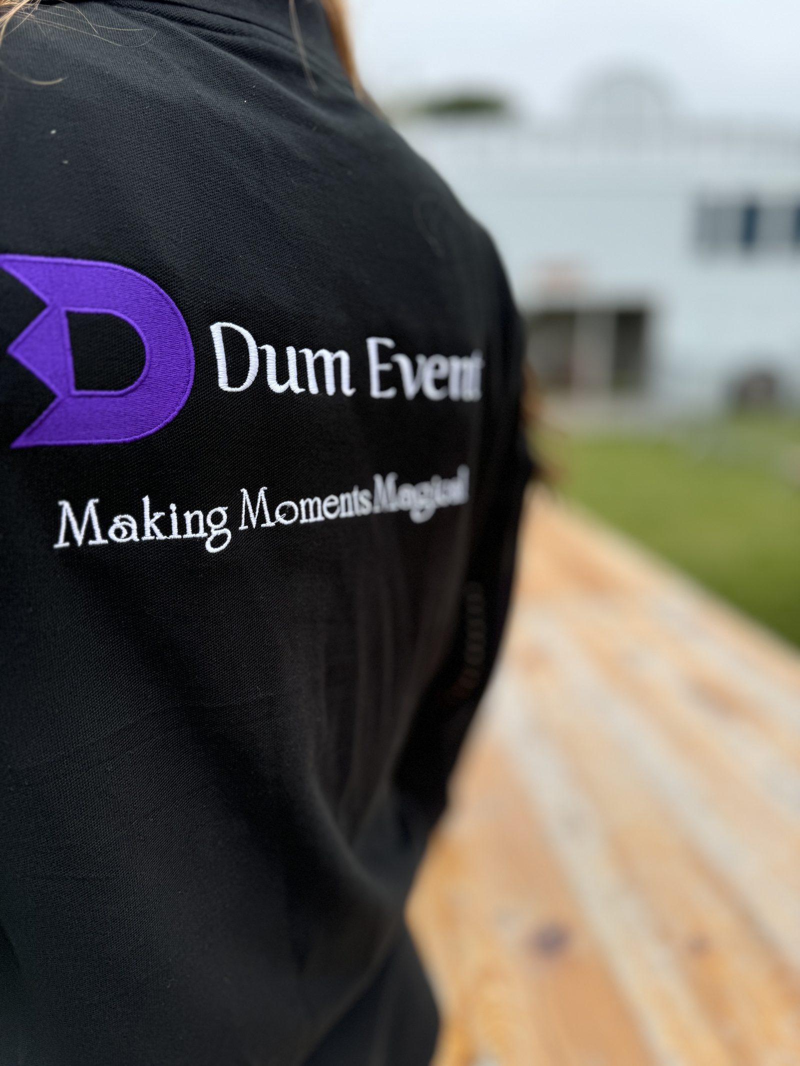 Dum Event team member in a branded jacket on site