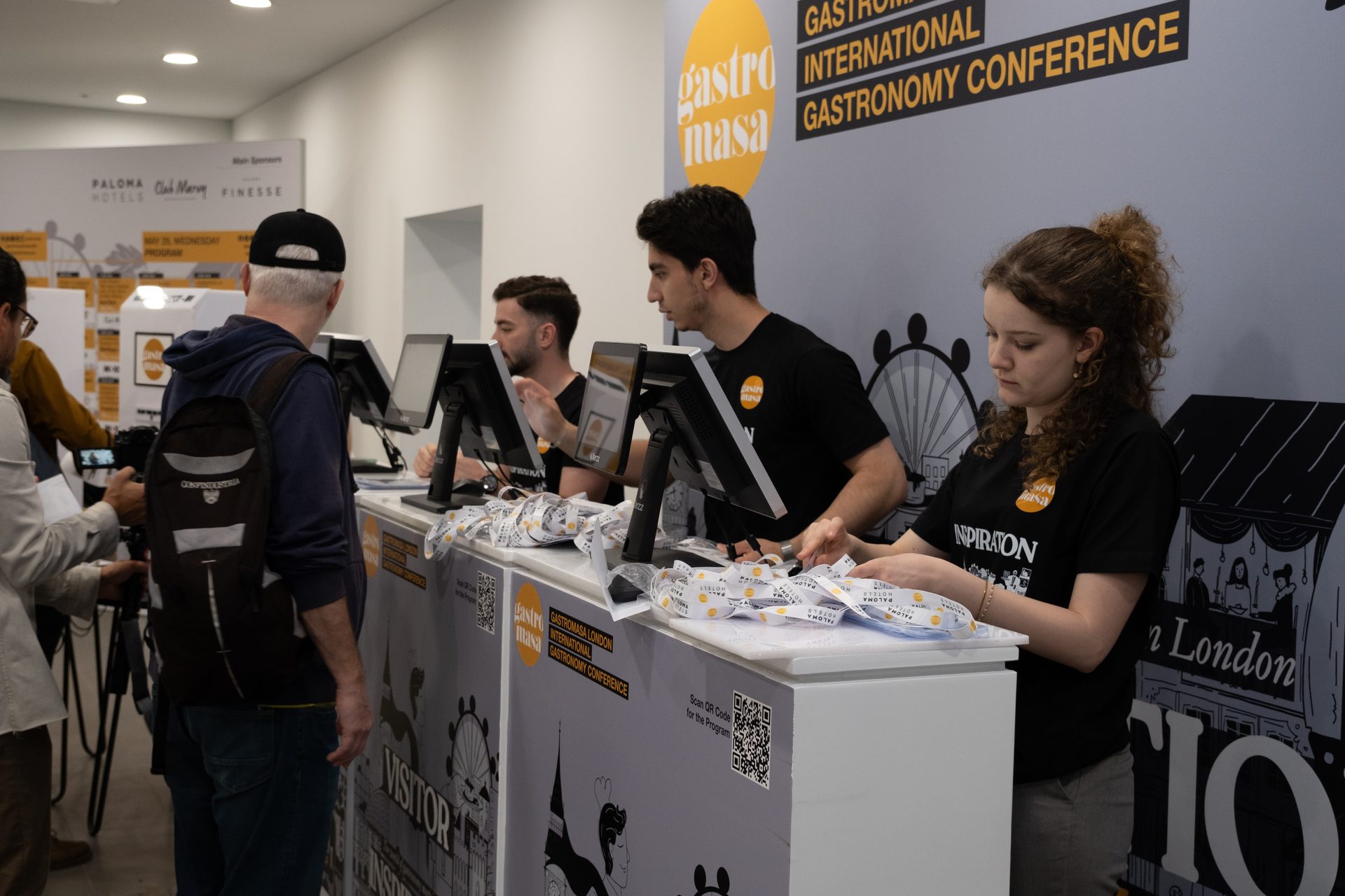 Dum Event staff welcoming guests at conference hospitality counters
